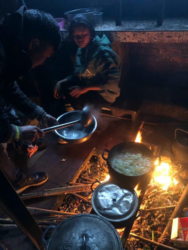 Vietnam Eco Tours: Sustainable & Family-Friendly Options 4 Destination_guide - Local people cooking for the dinner in Sapa trip.